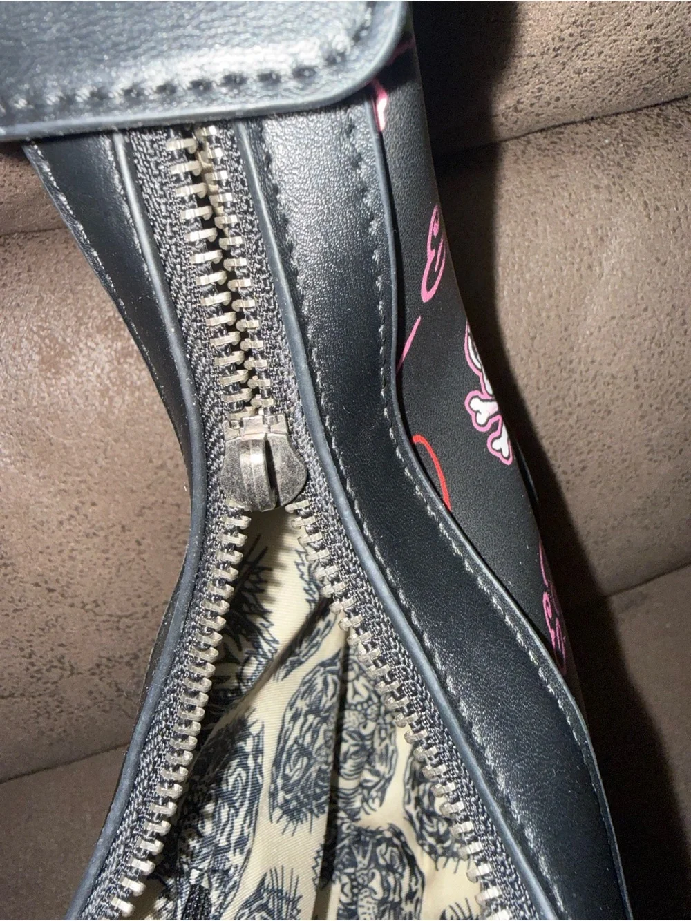 Signature Ed Hardy tattoo print Shoulder Bag with Skull, Rose & Pink accents.